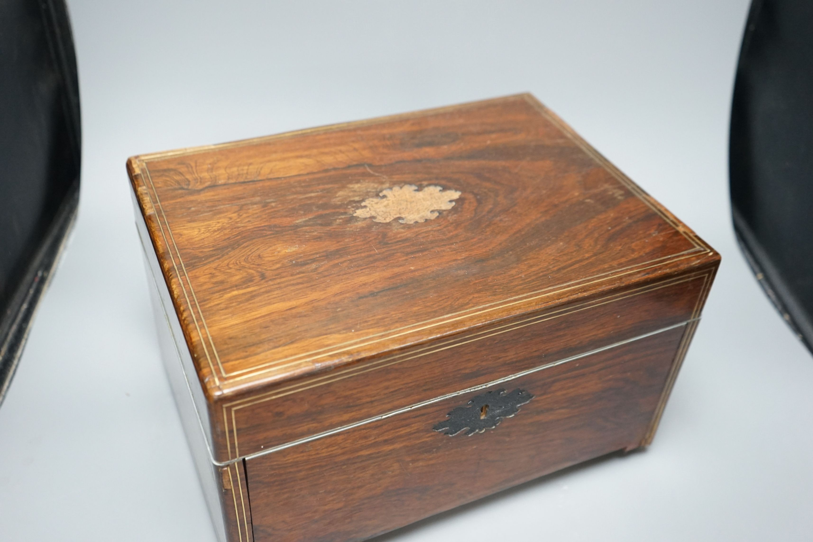 A Victorian rosewood stationery box, with red Morocco interior, by S Woodfield, 21 high x 35cms wide